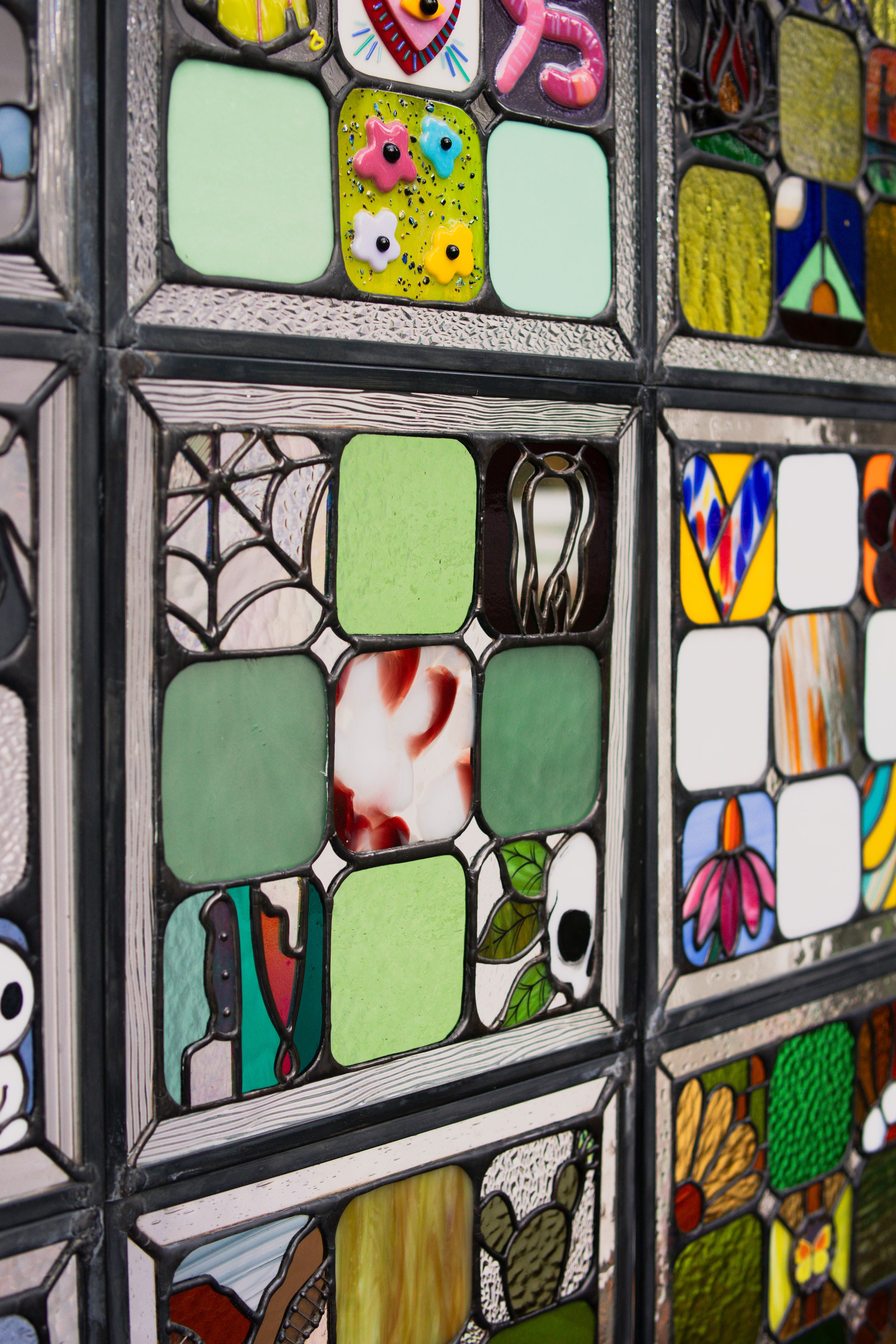 Close up of stained glass quilt and the mini panels