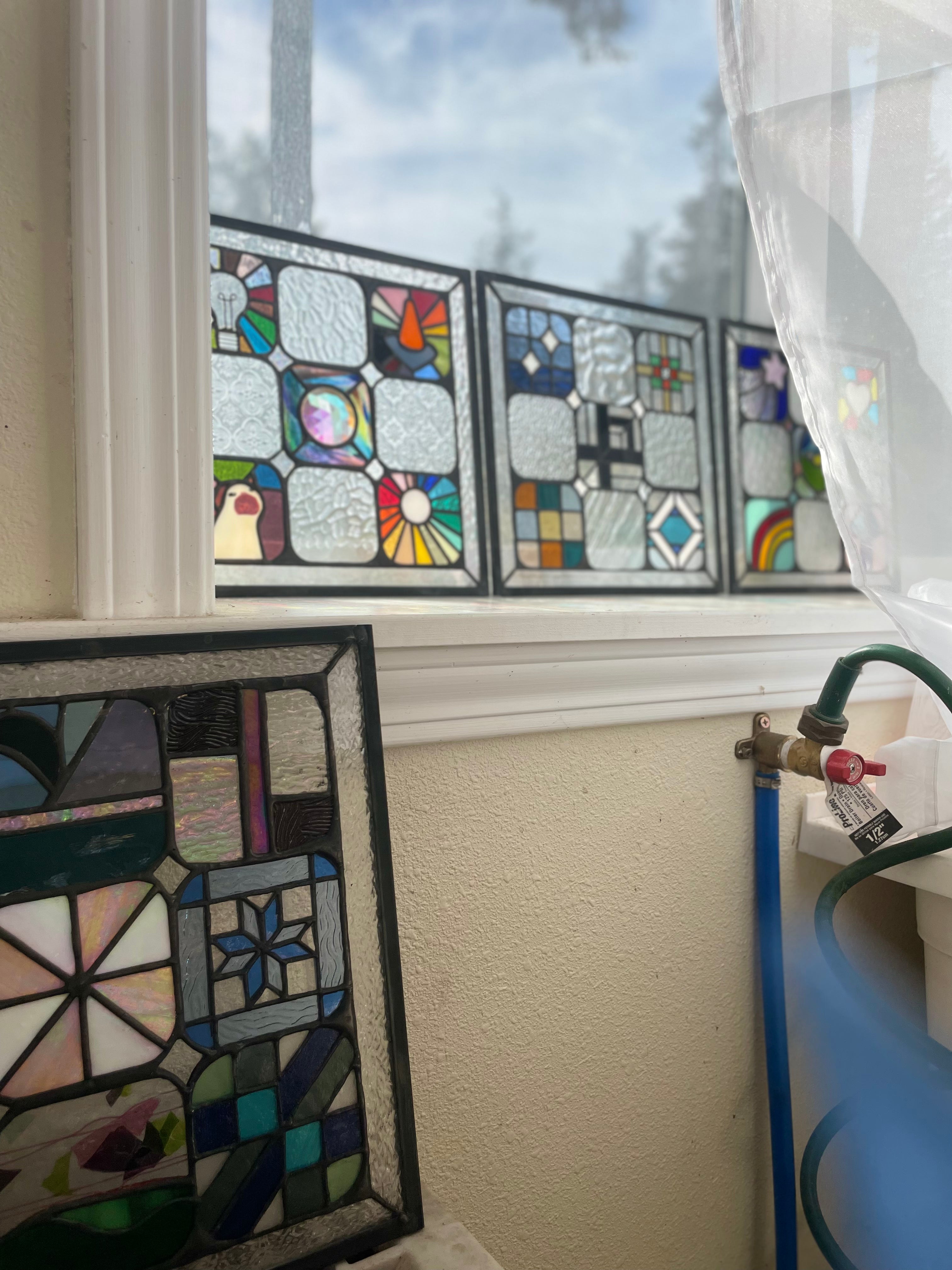 Stained glass quilt being assembled 