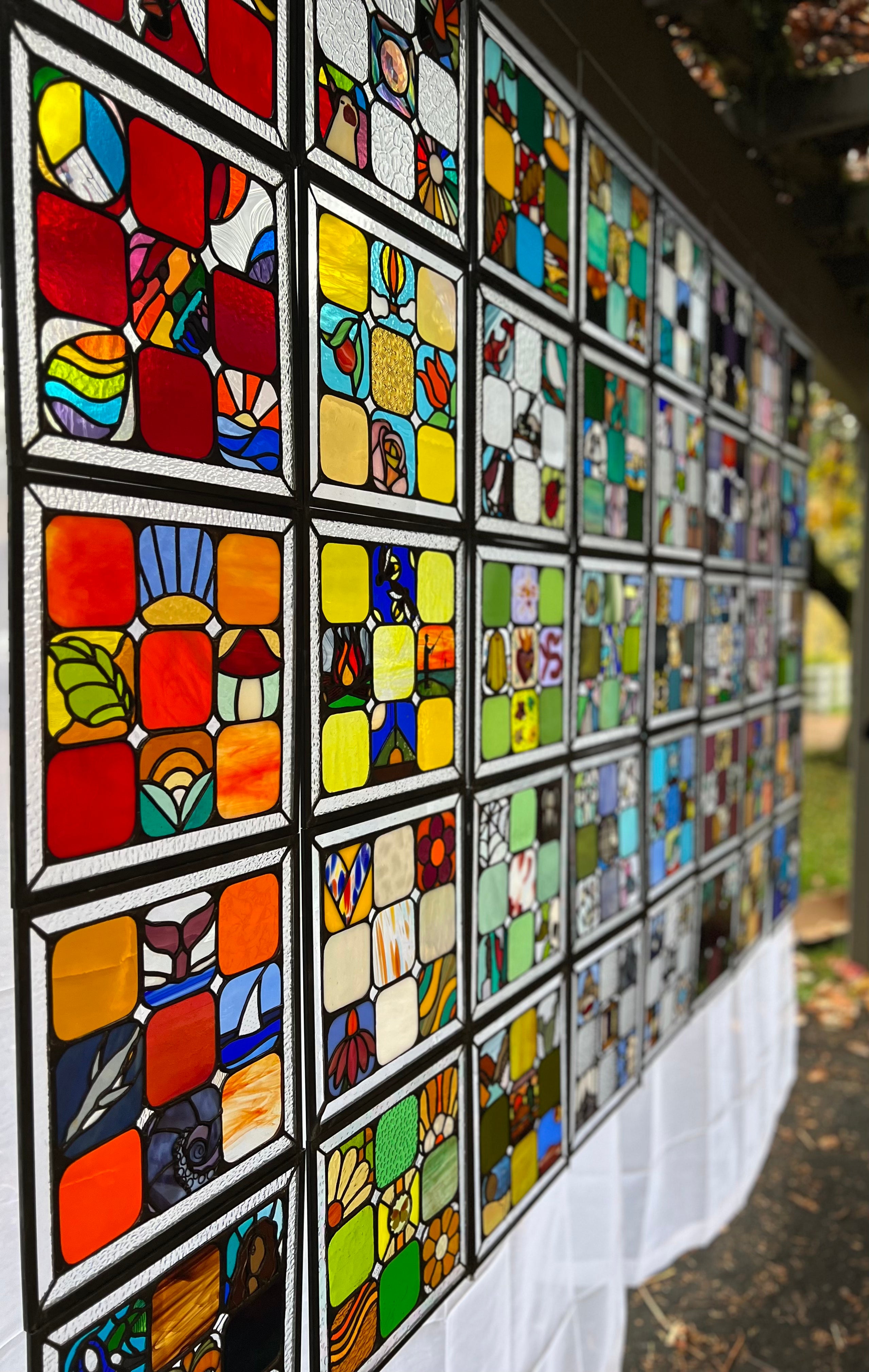 Glass quilt assembled by stained glass artist Korina Oswald